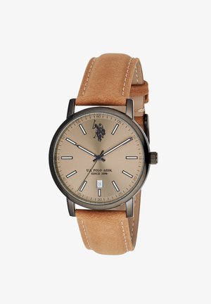Orologio rotondo beige U.S. Polo Assn. con cassa in metallo nero, cinturino in pelle beige, indicatori minimalisti, tre lancette e display della data alle 6.