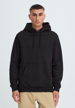 Black hooded sweatshirt made of cotton blend, featuring a kangaroo pocket, drawstring adjustable hood, and ribbed cuffs and hem.