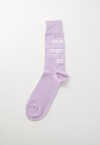 Lilac cotton sock with a ribbed cuff, featuring white text that reads "MAKING IT THROUGH THE RAIN." Smooth texture, standard sock shape.