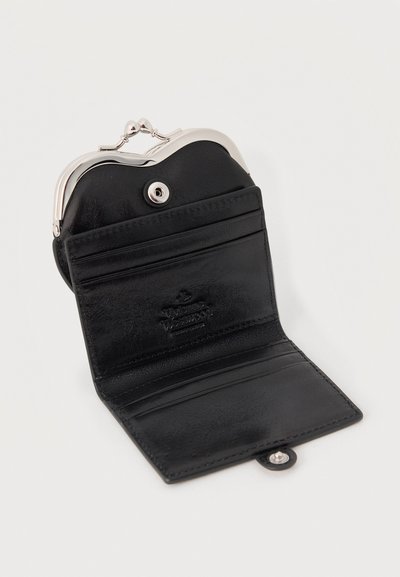 Black leather wallet open to show card slots and a silver clasp coin compartment at the top on a white background.