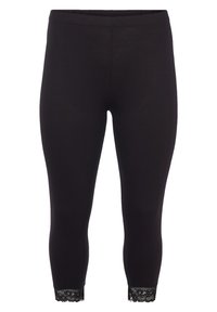 Leggings noirs avec une texture lisse et une coupe ajustée, ornés de dentelle à la cheville. Taille élastique pour plus de confort.