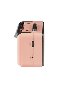 Pink portable speaker with a rectangular shape, black top panel, volume knob, and audio jack. Smooth texture and minimalist design.