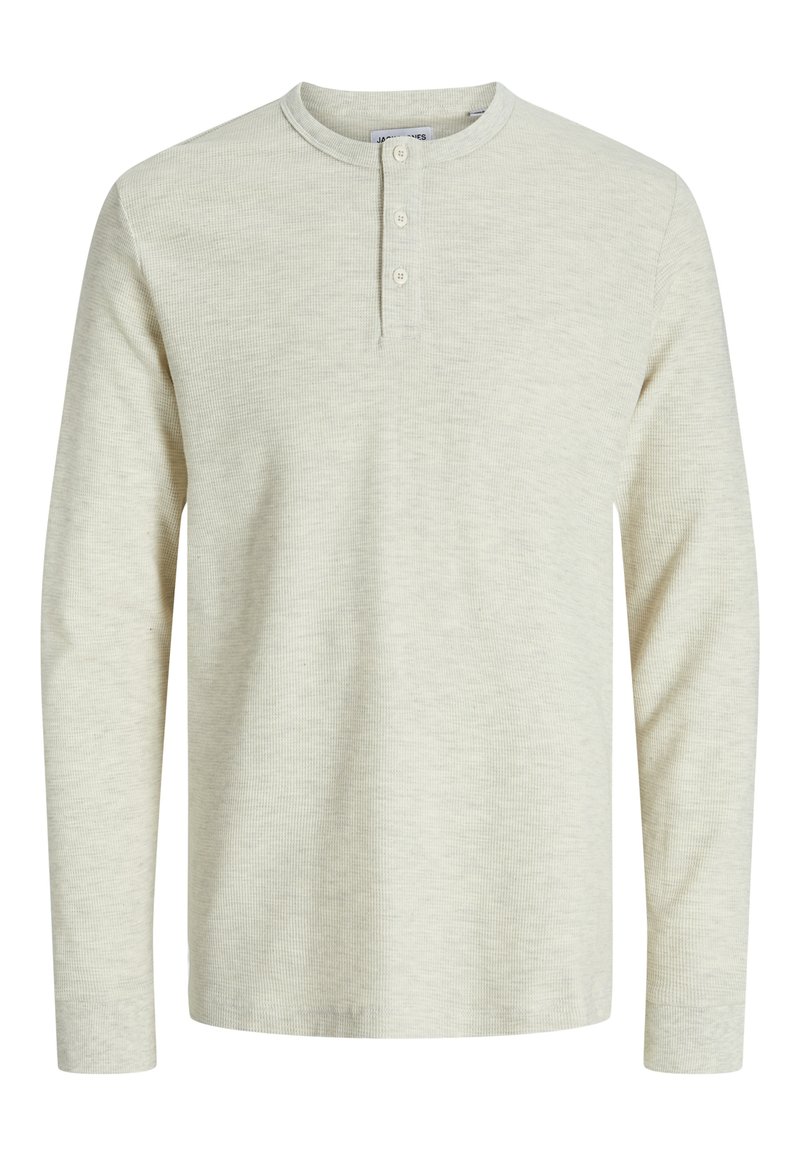 Long-sleeve, light beige henley shirt, featuring a ribbed texture, rounded neck, and three-button placket at the front.