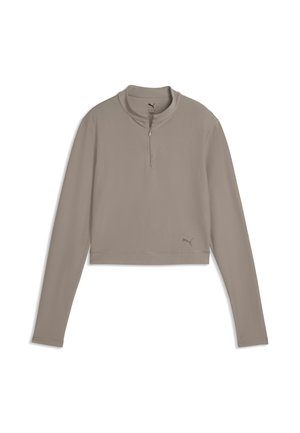 Sweat-shirt crop à manches longues couleur taupe avec une fermeture éclair sur un quart et un logo Puma subtil en bas à gauche.
