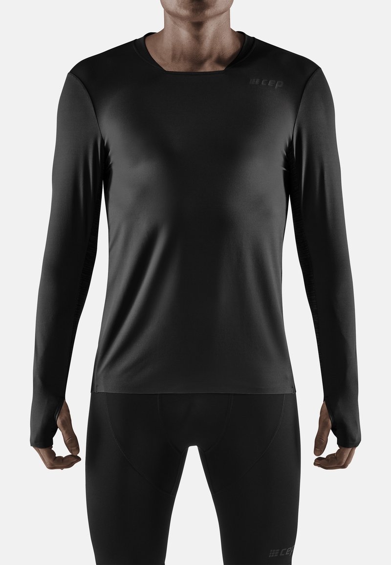 Czarna, długosleeve'owa koszulka sportowa wykonana z elastycznego materiału o gładkiej teksturze, z okrągłym dekoltem i minimalnym logo.