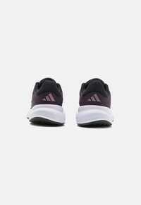 Purple mesh running shoes with black accents, padded collar, white midsole, and textured black outsole. Rear view highlights the logo.