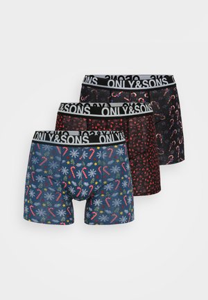 Three pairs of men's boxer briefs: blue with candy cane and snowflake pattern, black with red patterns, and a floral black design, all with branded waistbands.