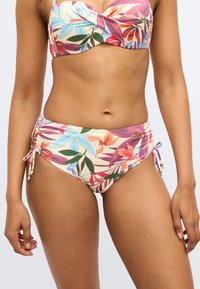 Ziedu bikini augšdaļa ar izgriezuma detaļu, krāsainiem tropu rakstiem. Apakšdaļai regulējamas saites ar pērlītēm, saskaņotā dizainā.