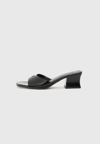 Heeled mules - black