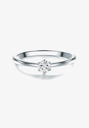 Silver ring with a smooth band and a central round-cut diamond, secured by six prongs, reflecting light against a white background.