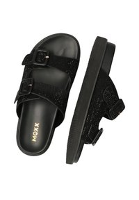 Zwarte sandalen met dubbele verstelbare gespen en een gestructureerde band. Gemaakt van synthetische materialen met een platte rubberen zool. Gouden logo-detail.