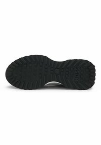 Black rubber sole with textured patterns for grip. Features a grey upper with mesh detailing and a subtle logo on the side.