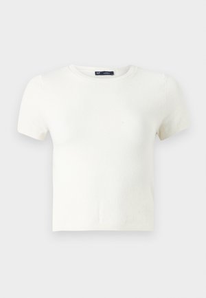 Bijela kratka majica s kratkim rukavima izrađena od mekog materijala. Ima klasičan kroj s okruglim izrezom i uski fit bez vidljivih uzoraka ili akcenta.