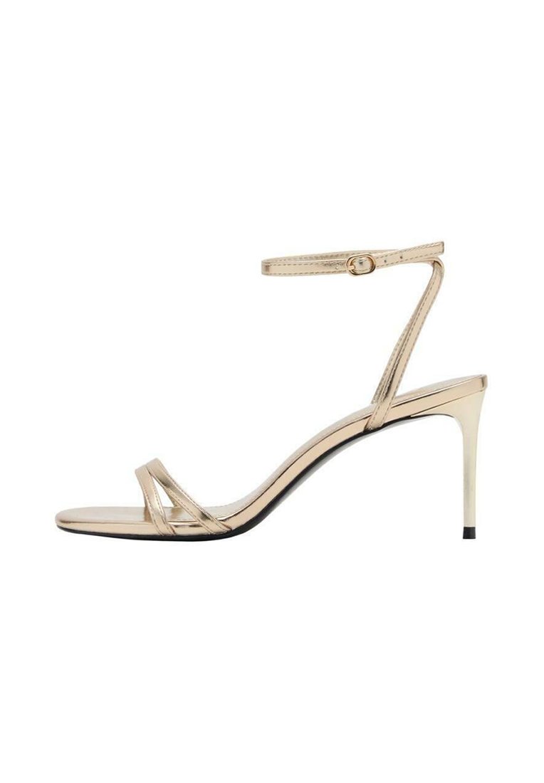 Gold metallic high-heeled sandal with a thin strap around the ankle, open toe, and slender cross straps. Glossy finish with black sole.