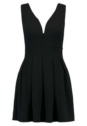 Black dress with a deep V-neck, sleeveless design, flared skirt, made from textured fabric. Features pleats for added volume.