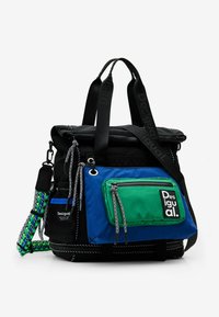 Black nylon bag with green and blue fabric accents, multiple zippered pockets, short handles, and patterned straps. Features logo patch.