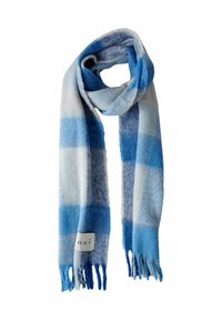 Écharpe à carreaux bleus et blancs faite d'un tissu doux et texturé ; présente des extrémités à franges et une étiquette tissée avec "oui".