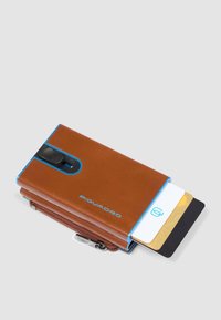 Brown leather wallet with blue accents, featuring a card slot and zippered compartment. Smooth texture with branded logo.