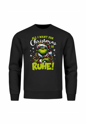 Schwarzer Sweatshirt mit einem bunten Grafiken eines grünen Charakters, umgeben von Weihnachtslichtern und dem Text: "Alles, was ich mir zu Weihnachten wünsche, ist RUHE!"
