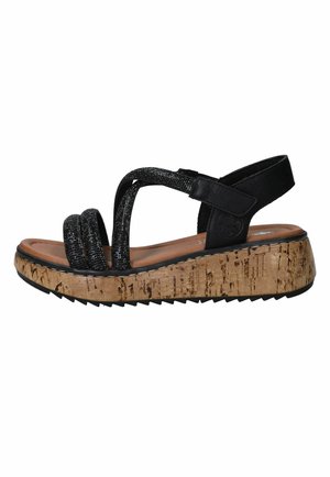 Black strappy sandal with glittery front straps, adjustable back strap, cushioned footbed, and cork-textured platform sole with treaded bottom.