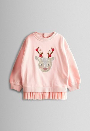 Heled roosa pika varrukaga tüdruku särk ribidega mansettidega, millel on sädelev hirve nägu lillelistest sarvedest ja volangiga äär.