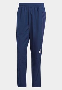 Marineblauwe sportbroeken met een elastische tailleband, tapersnit, zijzakken en een wit merklayout op het onderbeen. Glad, lichtgewicht stof.