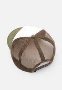 Brown mesh trucker cap with white front panels and green curved brim, adjustable snapback closure at back, shown from above.