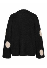 Cárdigan negro de punto con mangas oversize y acentos de lunares beige de peluche en los codos. Textura suave con un ajuste relajado.