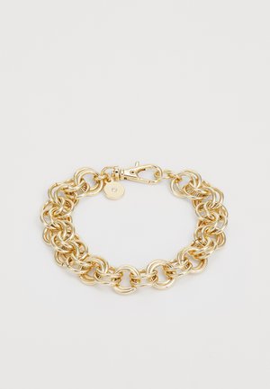 Gold-toned metal bracelet with interlocking circular links, featuring a lobster clasp and a small tag detail. Smooth surface texture.