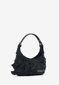 Denim handbag with an adjustable strap, featuring 3D floral appliqués in dark blue material. Embroidered logo on the front side.