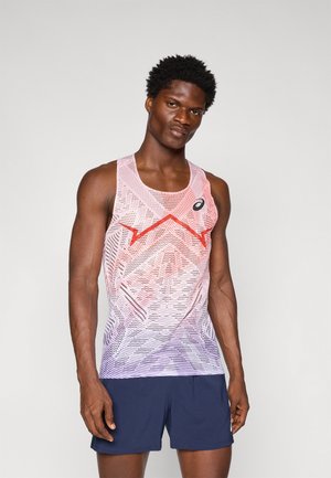Tank top featuring a gradient pattern from red to purple, with a geometric design, worn with navy shorts. Black logo on the left chest.
