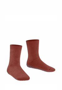 Calzini in cotone marrone con una parte superiore a costine e puntini blu antiscivolo sulla suola. Presentano un design fino al polpaccio e una texture liscia.