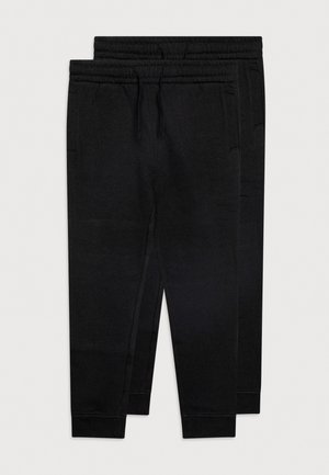 Deux pantalons de jogging noirs avec ceintures élastiques, cordons de serrage, poches latérales et poignets côtelés, posés l'un sur l'autre sur un fond blanc.