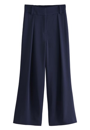 Tengerészkék, bőszárú nadrág redőkkel, övbújtatókkal és rejtett elülső rögzítéssel.