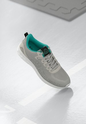 Gray athletic shoe with a mesh upper, teal accents, and a white sole. Features include laces and a black logo on the tongue.