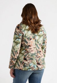 Floral-patterned blazer in green, pink, and blue hues; tailored fit with long sleeves and structured shoulders. Cotton blend fabric.