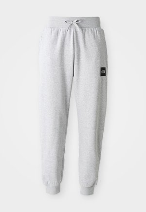 Pantaloni sportivi grigio chiaro con cintura elastica, coulisse, caviglie con polsino e un piccolo logo rettangolare nero sulla coscia destra.