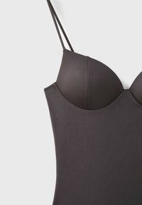 Dark gray sleeveless fitted dress with thin spaghetti straps and molded padded cups on a light background.