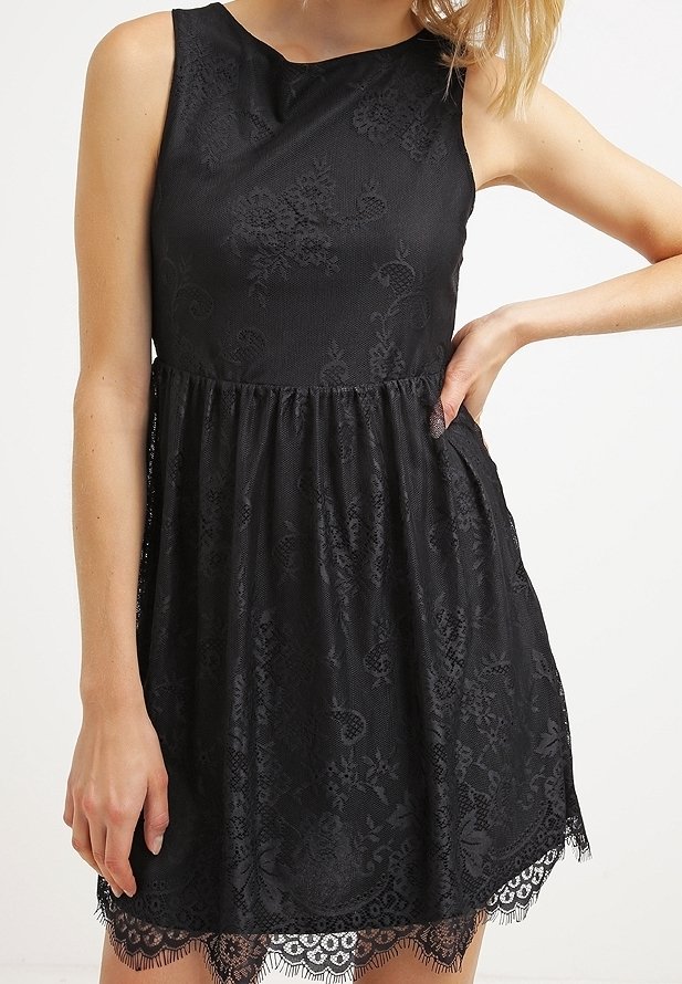 Black dress with a textured floral pattern, sleeveless design, gathered waist, and lace trim at the hem.