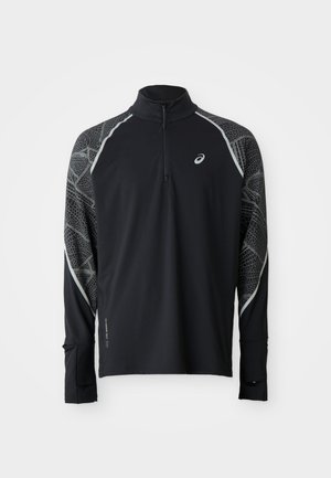 Must värvi spordipoe pikkade varrukatega topp, millel on veerandzipper, peegeldavad detailid ja tekstureeritud muster varrukatel. Pehme, elastne kangas mugavuseks.
