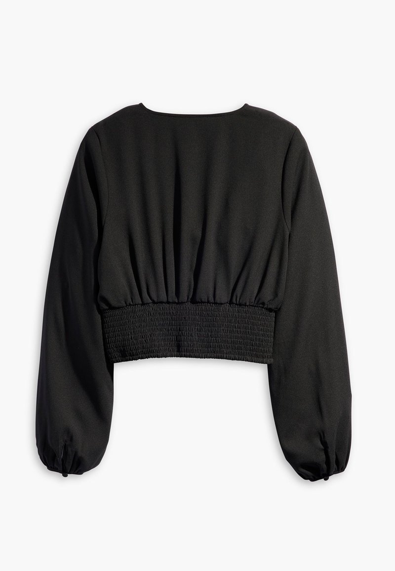 Schwarze, langärmlige, kurze Bluse mit elastischem, gerafftem Taillenteil und gerafften Manschetten, von hinten auf einem weißen Hintergrund gezeigt.