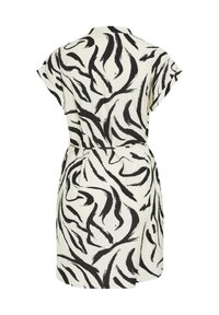 Vestido de manga corta en tejido ligero con fondo crema y patrones abstractos de pinceladas negras, ceñido en la cintura.