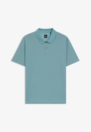 Light blue polo shirt featuring a textured pattern, short sleeves, and a classic collar with two buttons. Brand label visible on the collar.