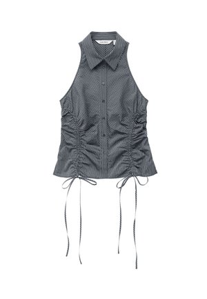 Blouse sans manches rayée noir et blanc avec boutons sur le devant, col, côtés froncés et longues cordelettes à l'ourlet.