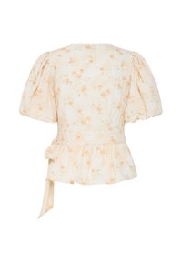 Blouse crème à manches ballon, petit imprimé floral pêche, basque et ceinture à nouer sur le côté, vue de dos sur fond blanc.