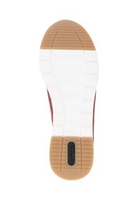 Sneaker sole with a treaded rubber bottom, white foam midsole, crimson upper fabric, and a circular logo detail near the heel area.