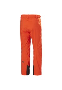 Heldere oranje waterdichte broek met zwarte accenten. Voorzien van een reguliere tailleband, een gladde textuur en gevormde knieën voor bewegingsvrijheid.