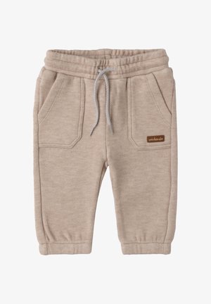 Beige Baumwoll-Sweatpants mit elastischem Bund, Kordelzug und zwei vorderen Taschen. Mit einem kleinen braunen Logosticker.