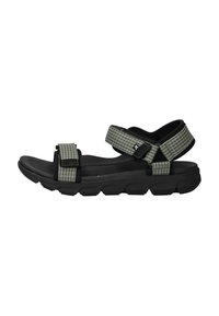 Black sandals with a textured upper featuring green grid patterns, adjustable straps, and a cushioned sole for comfort.