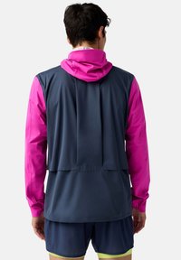 Men's athletic jacket with a pink hood and sleeves, greyish-blue body, lightweight fabric, featuring a layered back design and thumb holes.